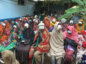 Group of Ethiopian individuals with bandages over their eyes after treatment
